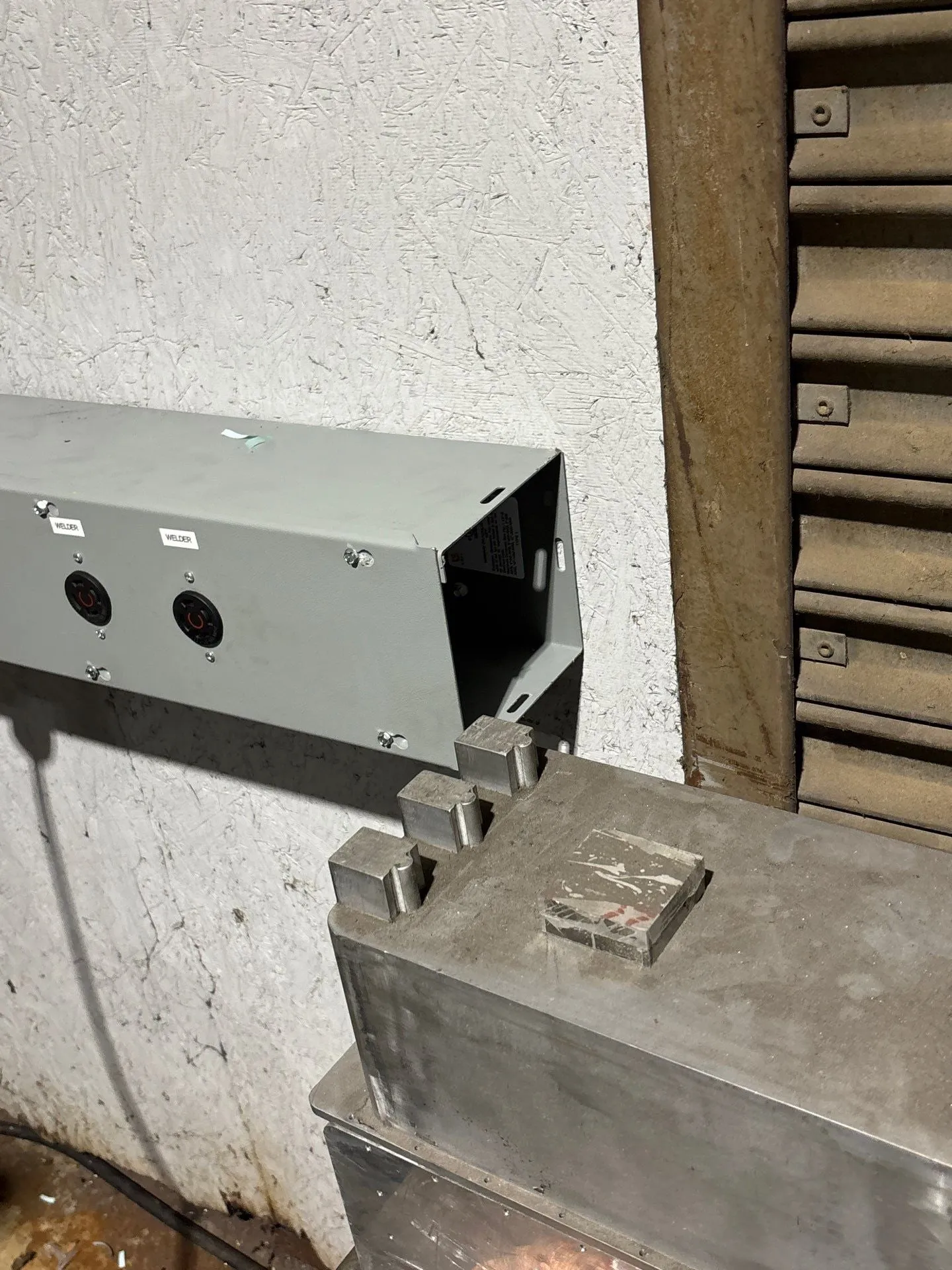 Machine connection box mounted at a CNC machine