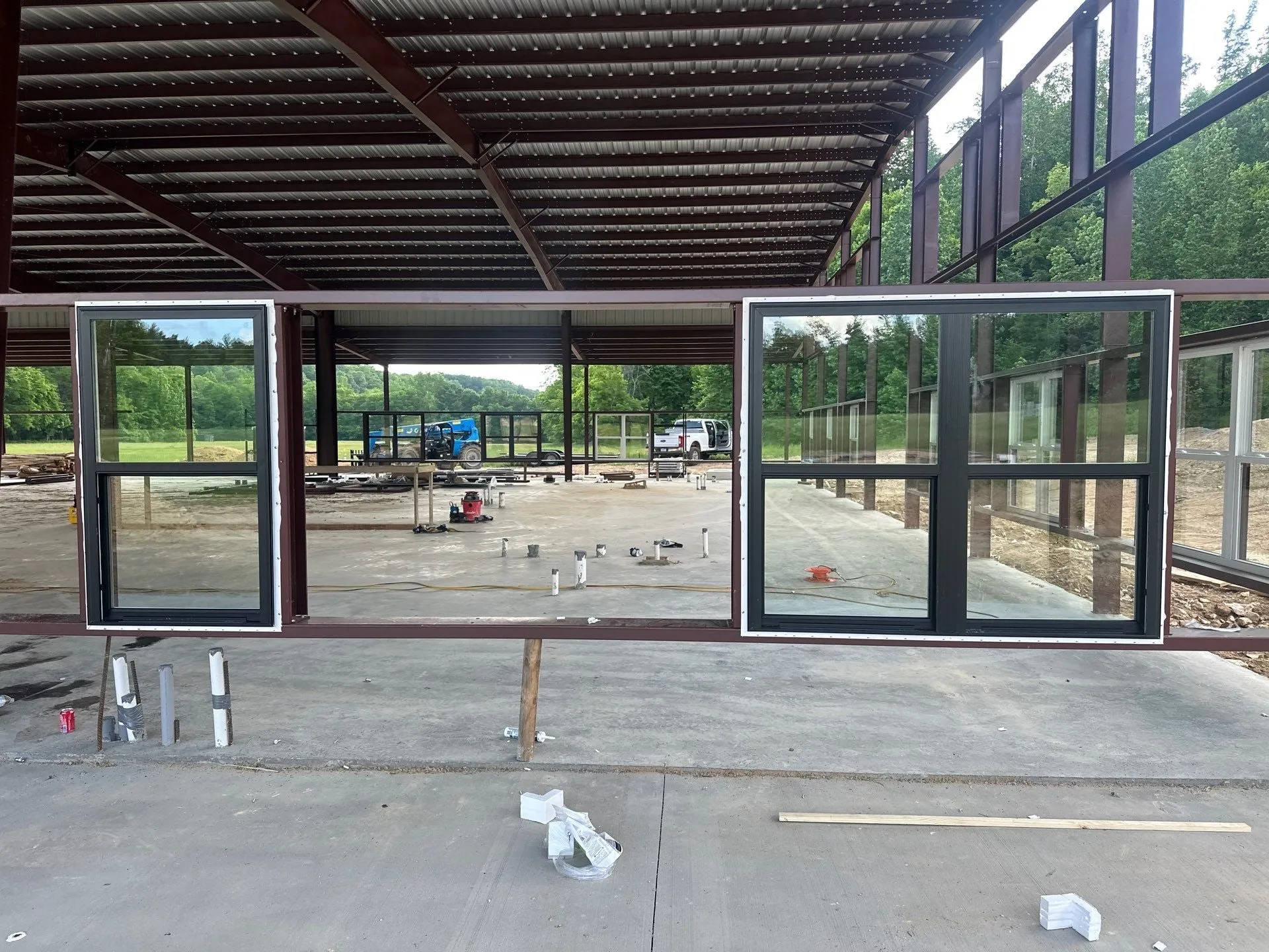 Hangar interior with a wall of windows looking out to the field