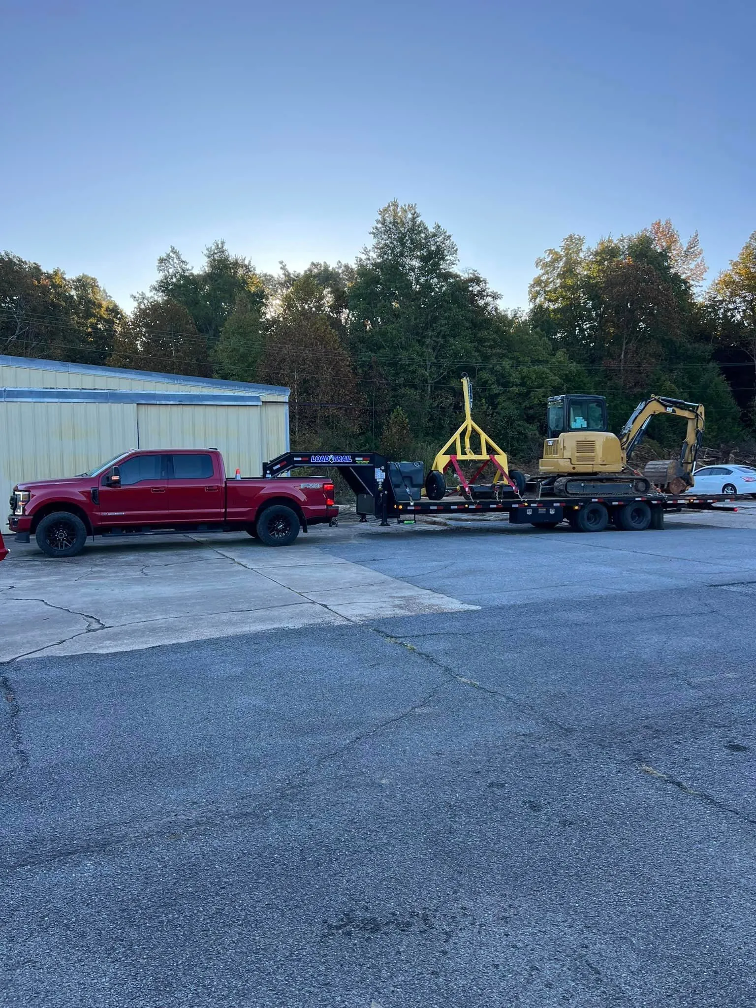 Horst Co pickup and equipment trailer staged at a job site