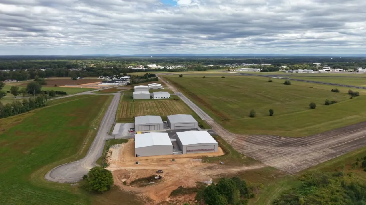 Aerial view of the two hangars beside the runway at Tullahoma