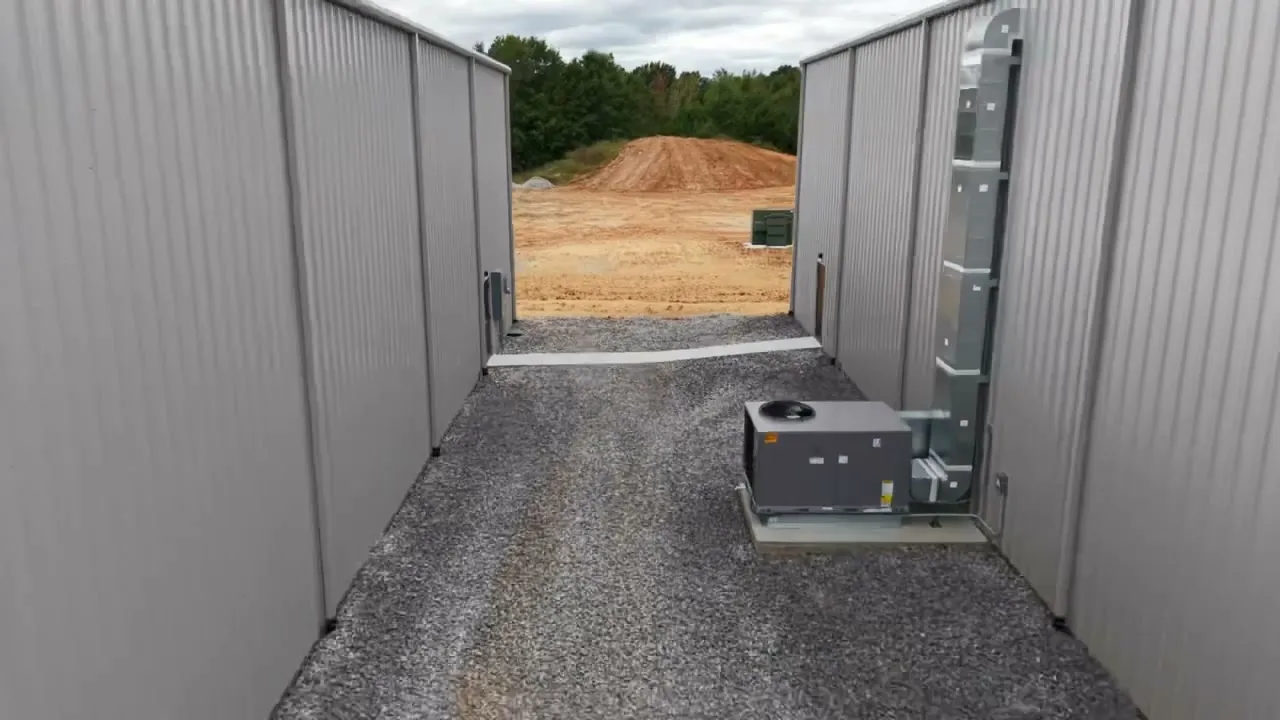 Looking down the gap between the two hangars toward the field